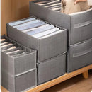 Caixa de armazenamento com grades para roupas